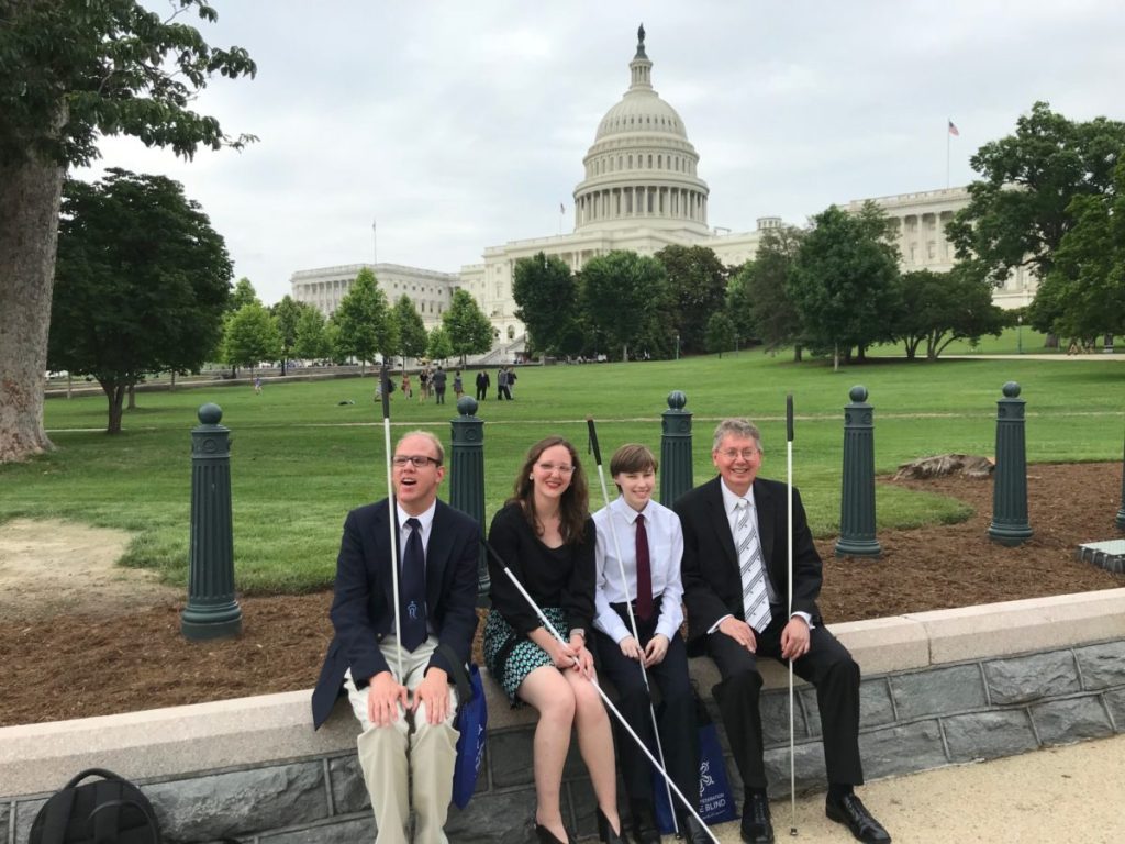 John Paré (at right), National Federation of the Blind's executive director of advocacy, and NFB interns at a previous year's Washington Seminar.
