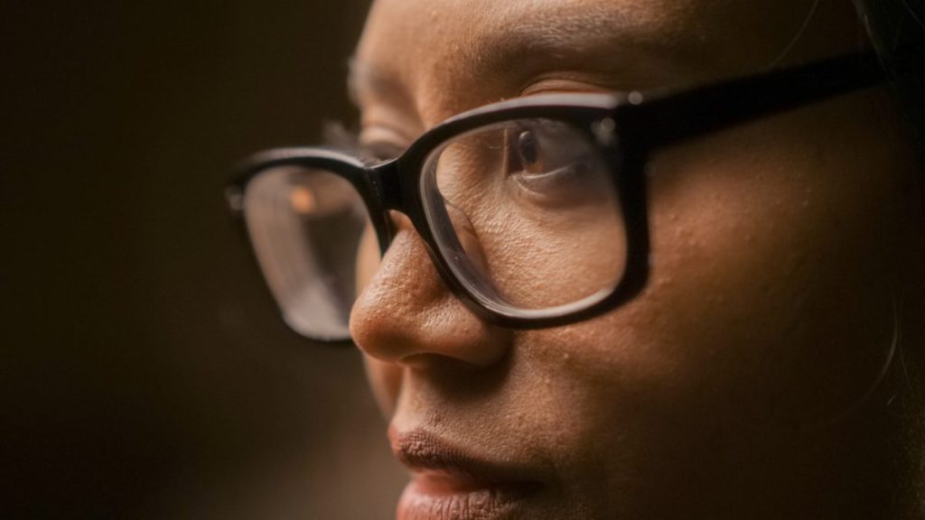 Image of black woman wearing glasses with serious expression