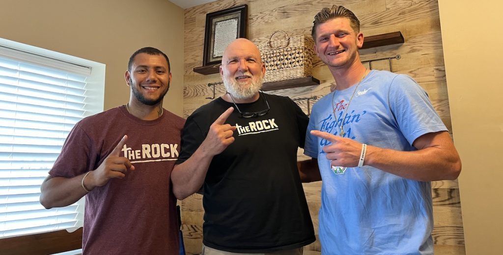 Pictured at The Rock: Alex on left, Buddy and Dave on the right